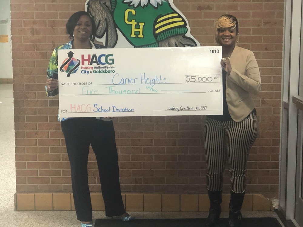 HACG with Carver Heights Elementary principal presenting donation
