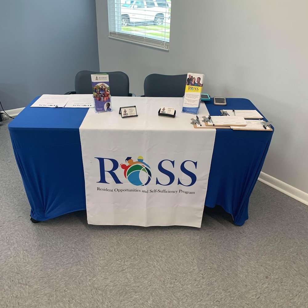 Rectangle table with ROSS logo and ROSS Marketing material 